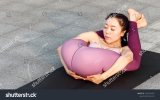 stock-photo-side-view-of-healthy-women-in-sportswear-practicing-yoga-outdoor-ashtanga-yoga-pos...jpg