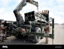 kherson-ukraine-31-june-2022-lance-cpl-right-steadies-a-rocket-pod-himars-and-lowers-the-pod-w...jpg